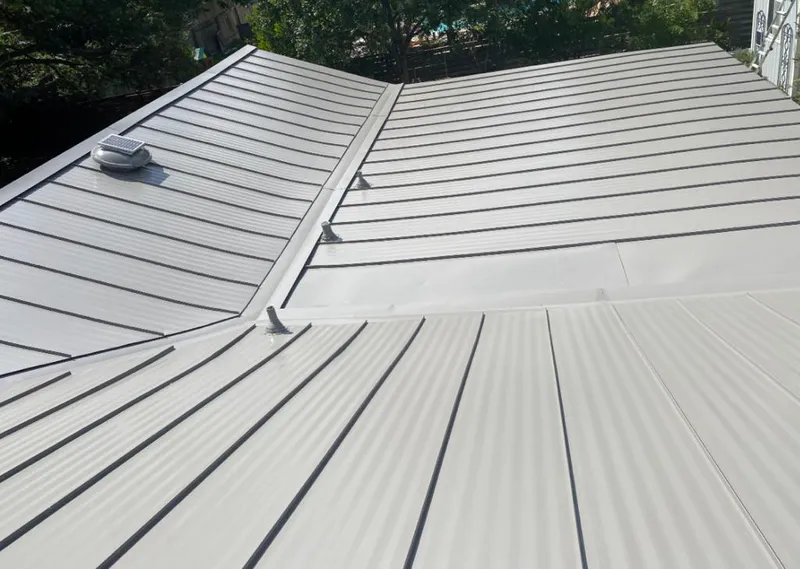 Solar attic fan installed on a metal roof for Roof Ventilation in Sidney
